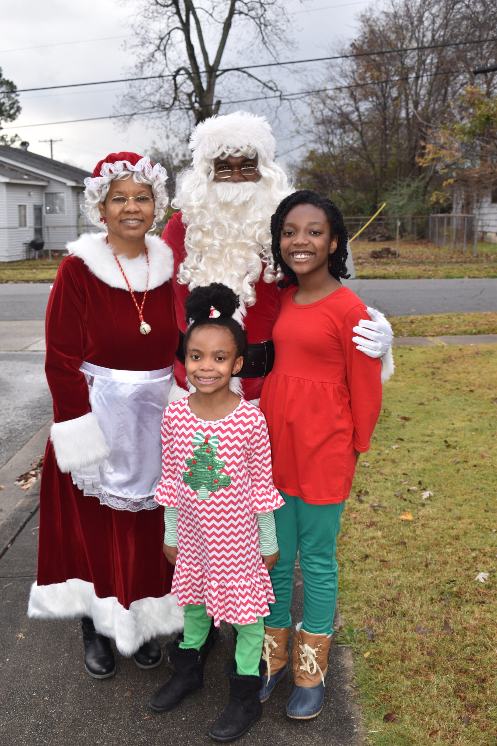 Ella and Delany Davis greet Santa & Mrs. Claus