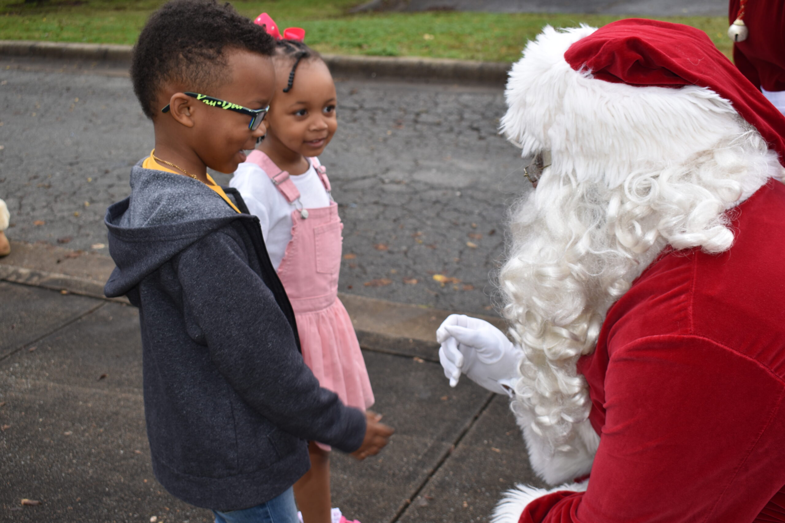 Santa listens as kiddos tell him what they want for Christmas