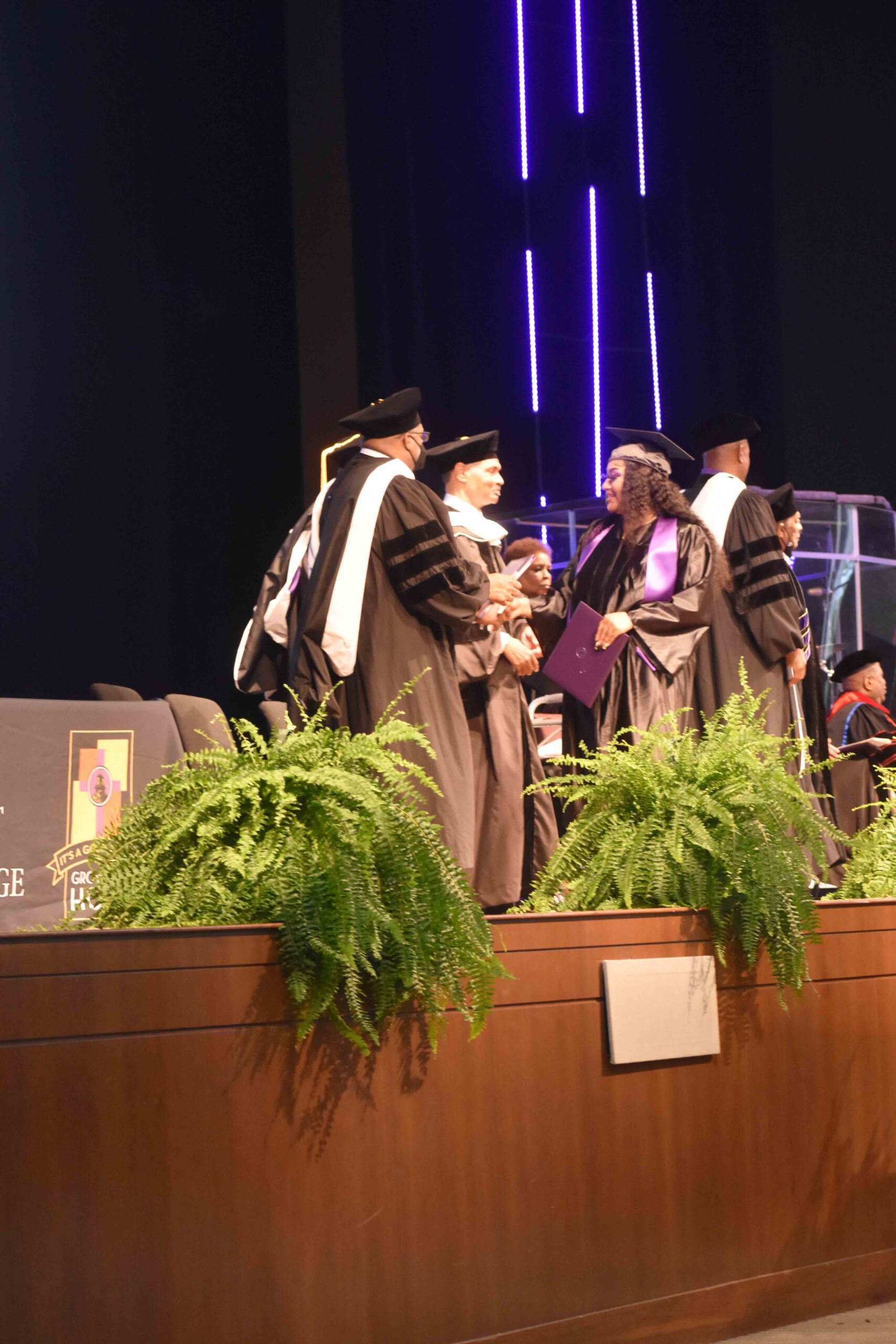 Calvary Robinson is congratulated by Rev., Dr. Jerry Black