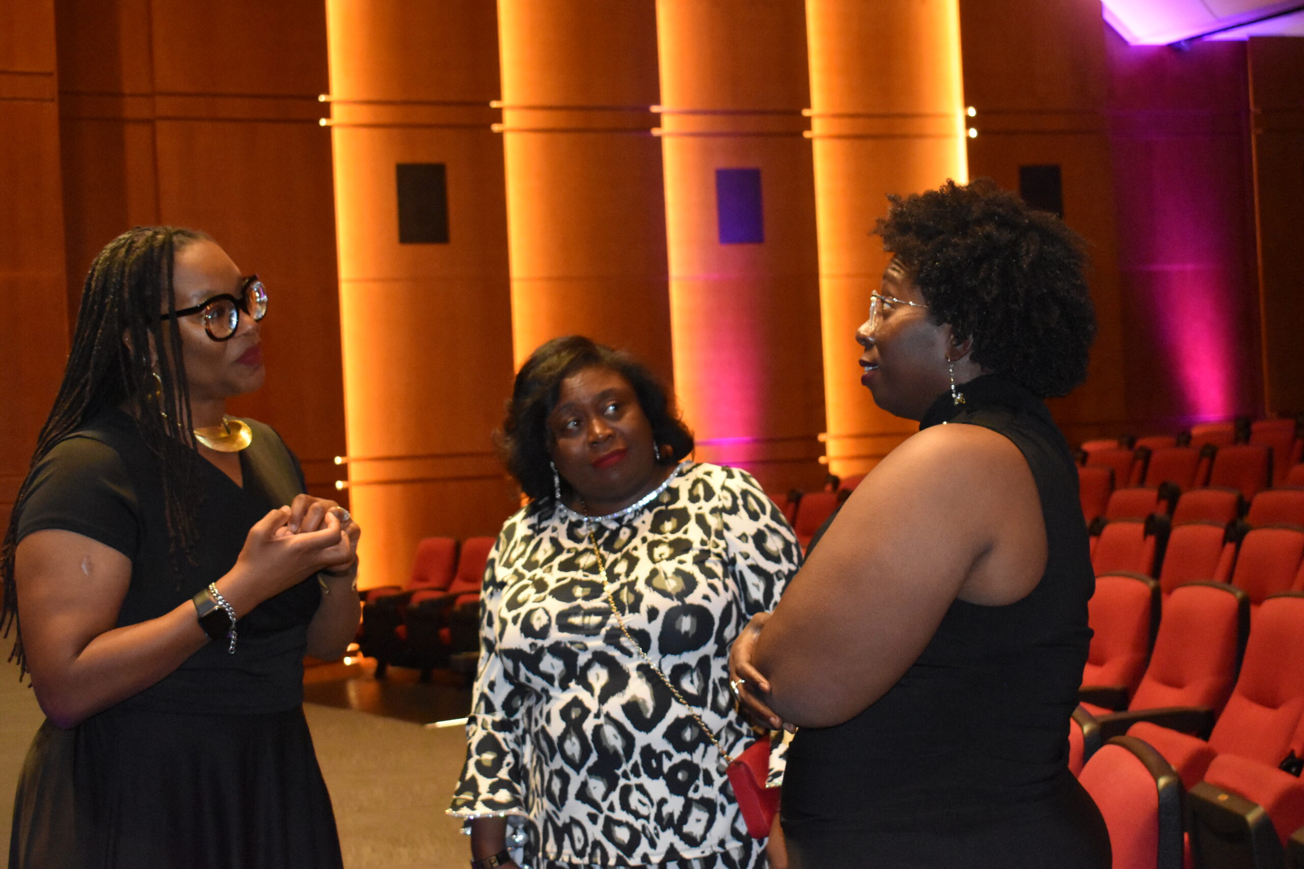 Dr. Cherisse Jones-Branch, Fredricka Sharkey, and Ebony Blevins chat after the even
